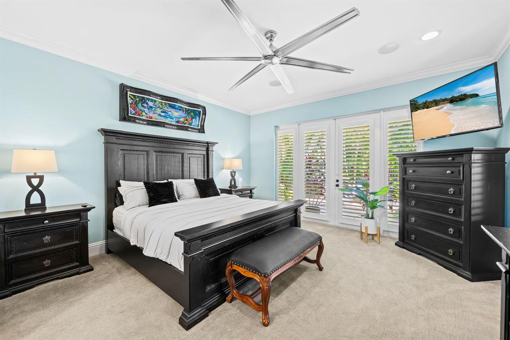 909 Turner Road Delray Beach, FL 33483 - Photo 19 of 50 a bedroom with a bed and furniture