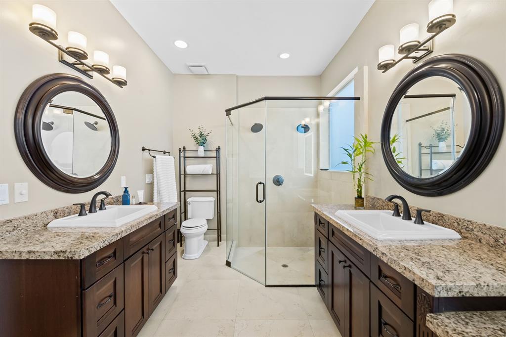 909 Turner Road Delray Beach, FL 33483 - Photo 20 of 50 a bathroom with a granite countertop double vanity sink and a mirror