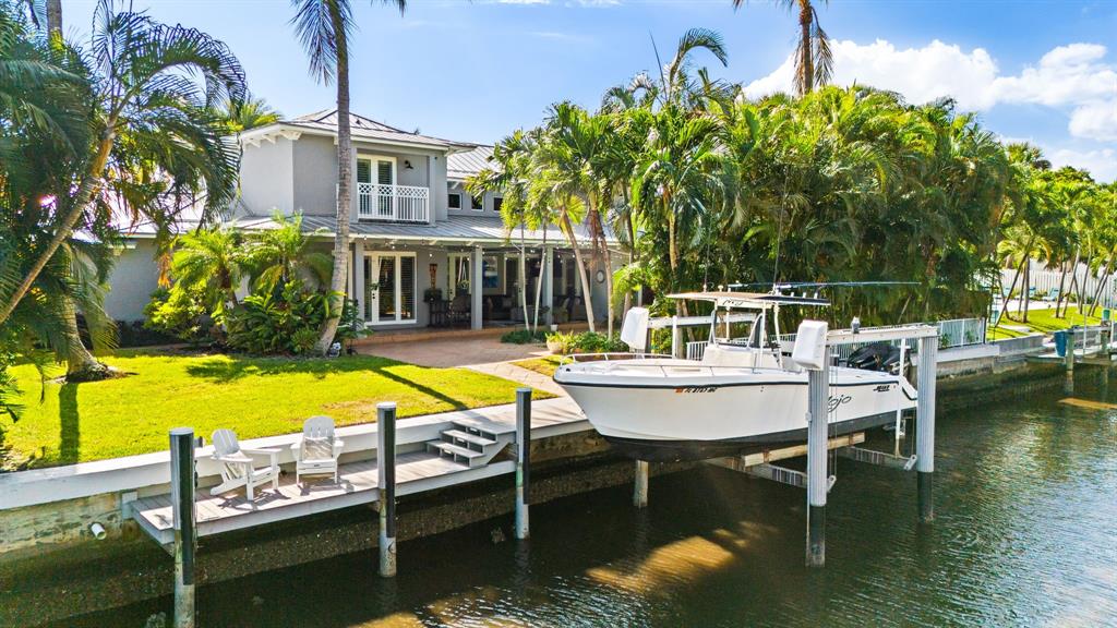 909 Turner Road Delray Beach, FL 33483 - Photo 2 of 50 a swimming pool with outdoor seating and yard