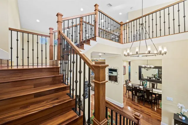 a view of entryway with wooden floor and a front door