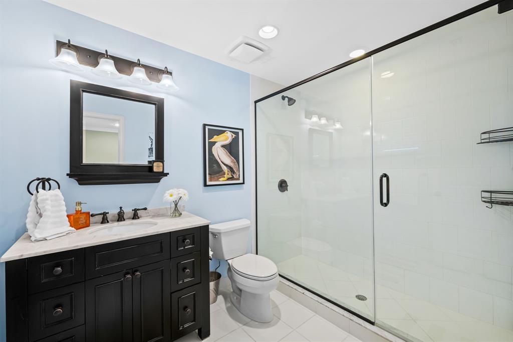 909 Turner Road Delray Beach, FL 33483 - Photo 26 of 50 a bathroom with a toilet sink and shower