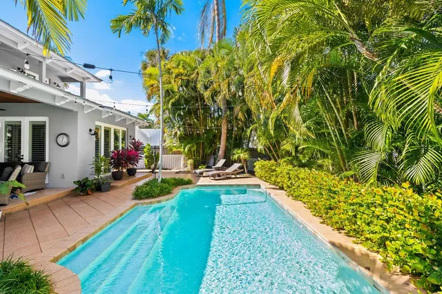 a view of swimming pool with outdoor seating
