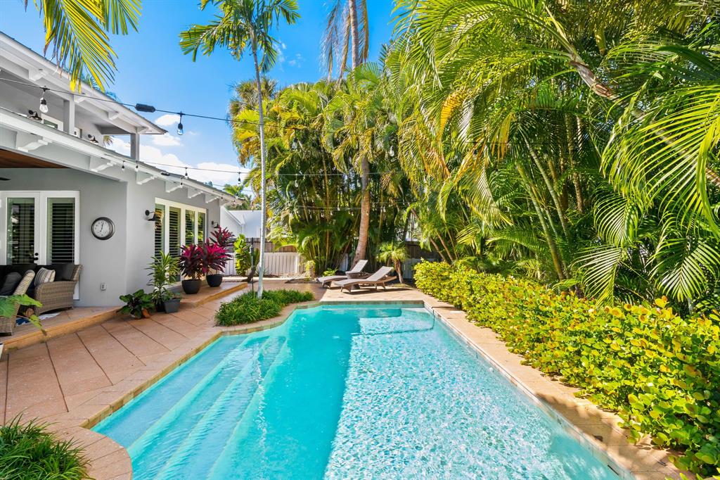 909 Turner Road Delray Beach, FL 33483 - Photo 3 of 50 a view of swimming pool with outdoor seating
