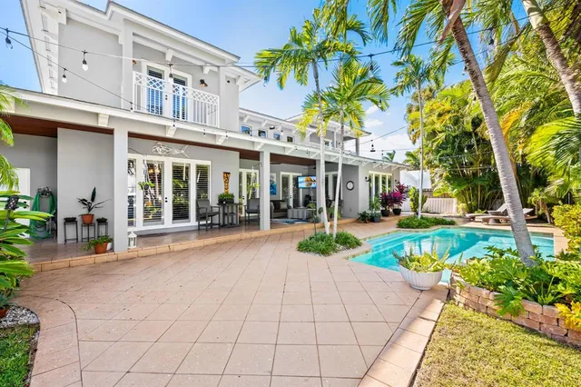 a view of a building with a patio and a garden
