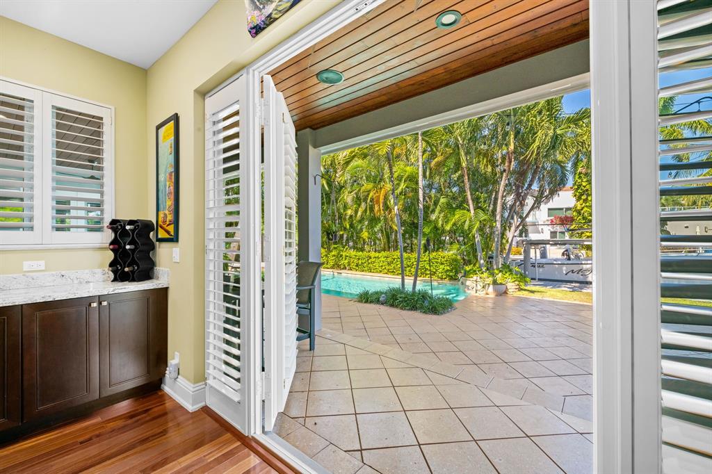 909 Turner Road Delray Beach, FL 33483 - Photo 40 of 50 a view of front door and porch with wooden floor