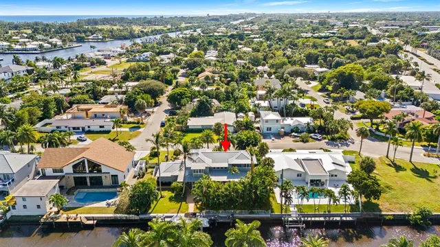 an aerial view of residential houses with city view