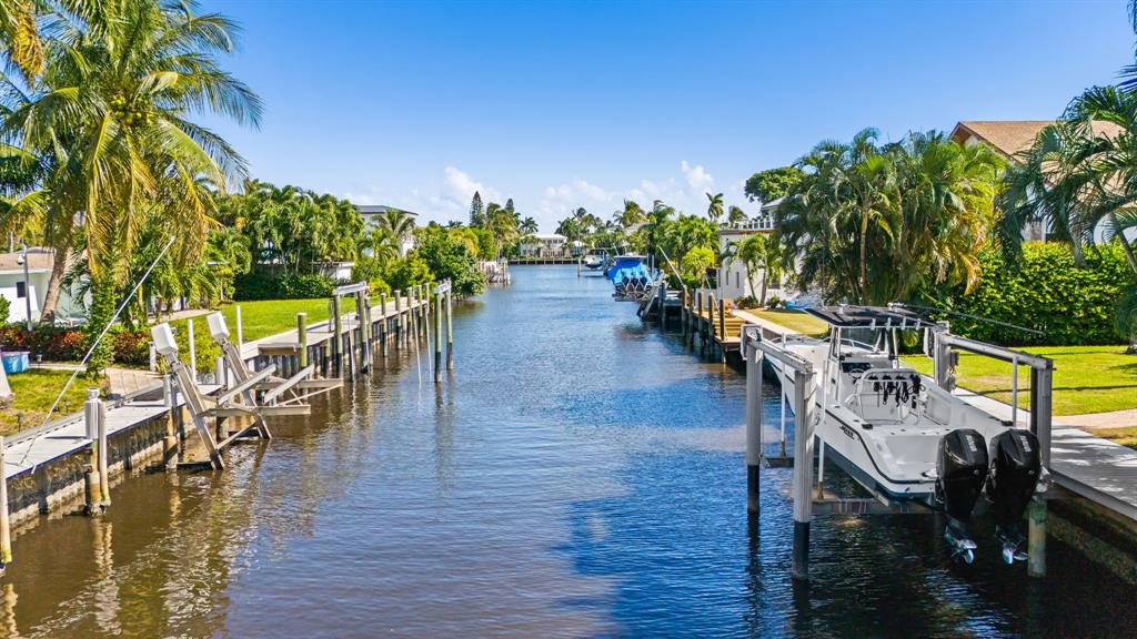909 Turner Road Delray Beach, FL 33483 - Photo 5 of 50 a view of a chairs and table on the wooden floor