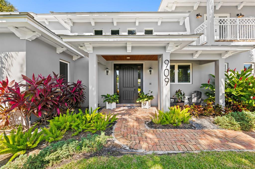 909 Turner Road Delray Beach, FL 33483 - Photo 6 of 50 a front view of a house with a porch