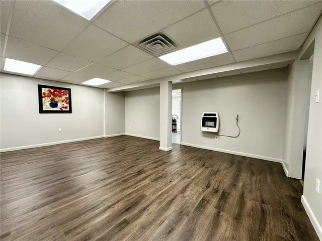 a view of a livingroom with wooden floor