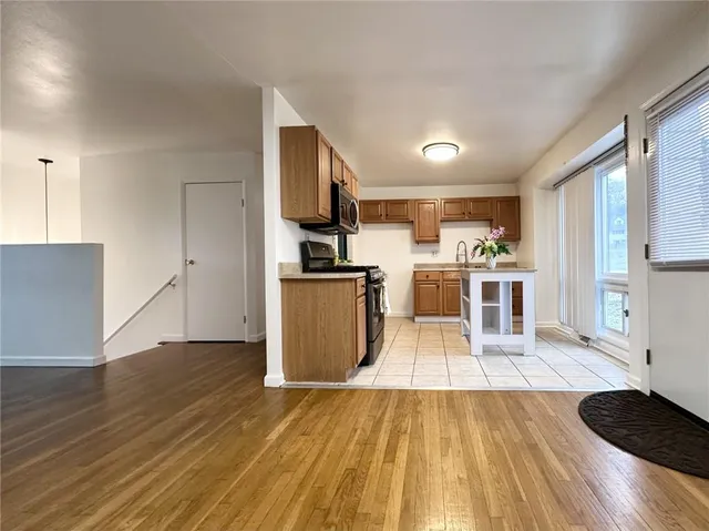 a view of kitchen with wooden floor