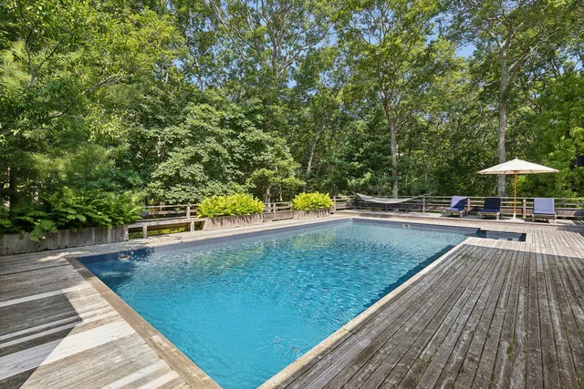 a view of a swimming pool with a patio