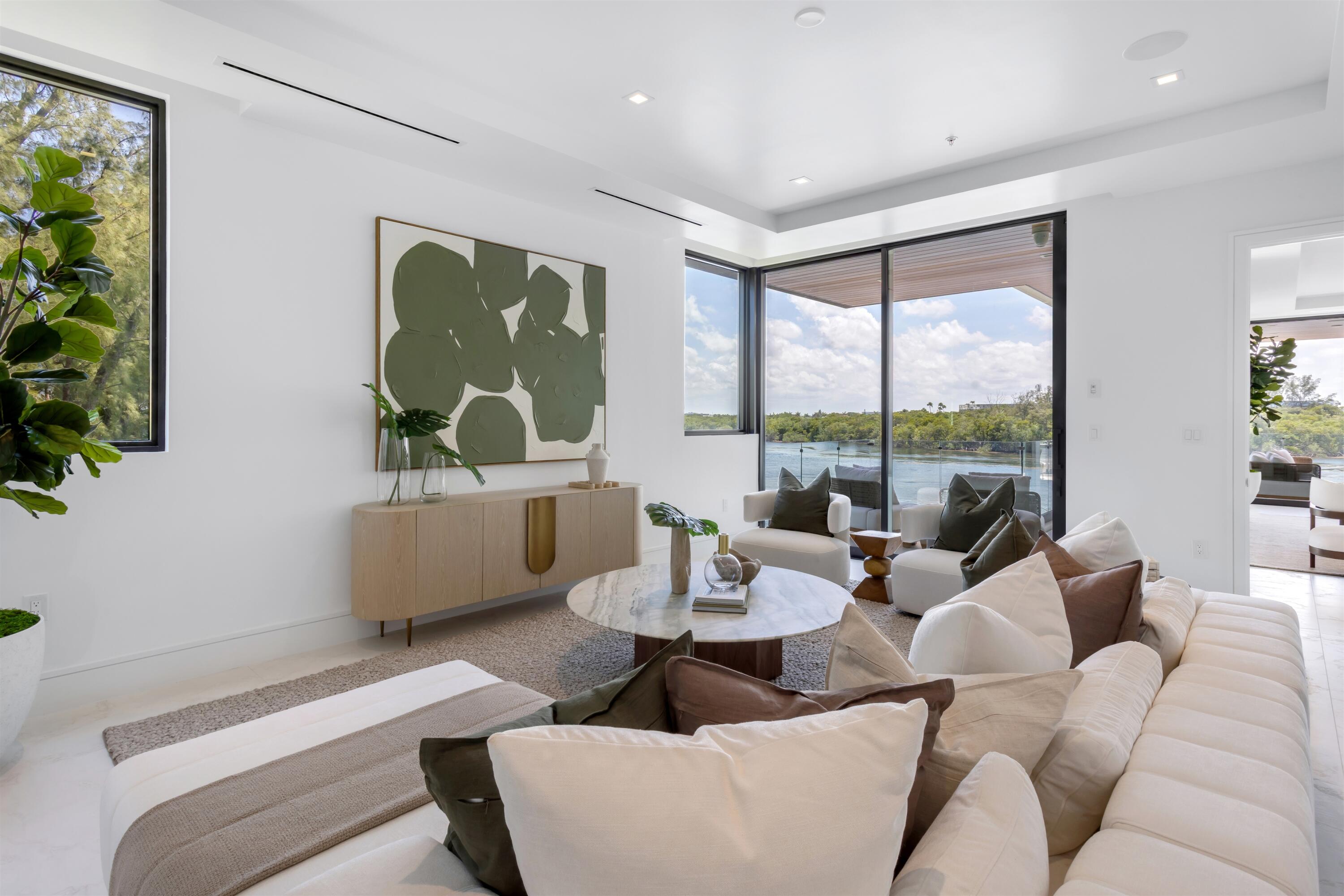 900 Lago Mar Lane, Unit PH Boca Raton, FL 33431 - Photo 18 of 58 a living room with furniture and a large window