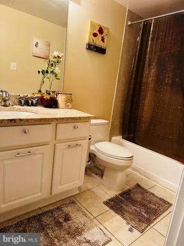 a view of a room with wooden floor and staircase