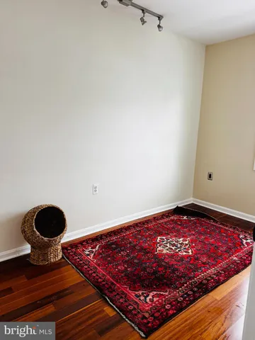 a view of kitchen island with wooden floor