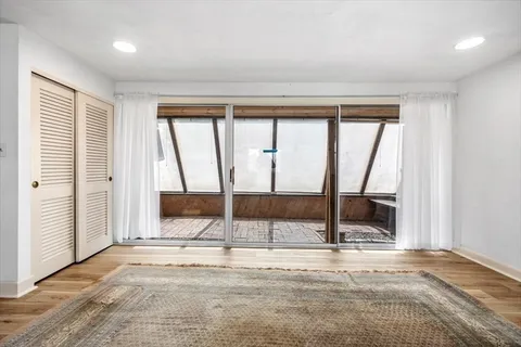 a bathroom with a sink toilet and window