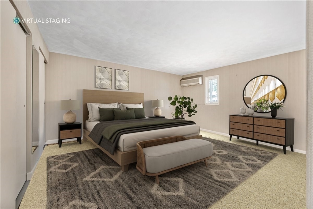 4 Richard Road Hingham, MA 02043 - Photo 19 of 37 a bedroom with a bed and painting on the wall