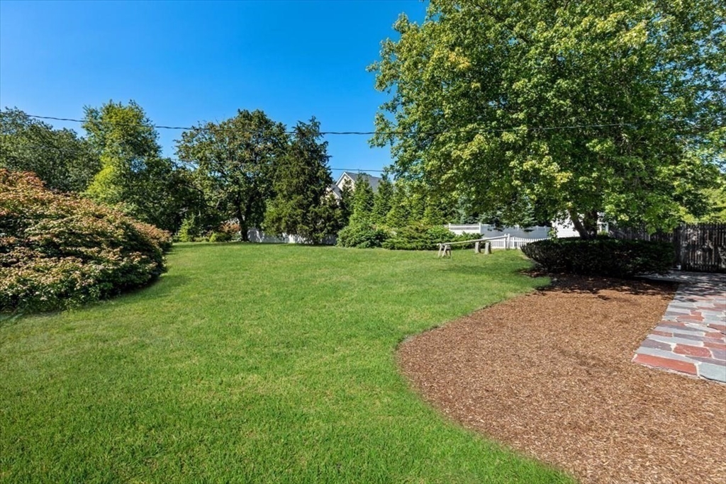 4 Richard Road Hingham, MA 02043 - Photo 26 of 37 a view of a garden with a bench