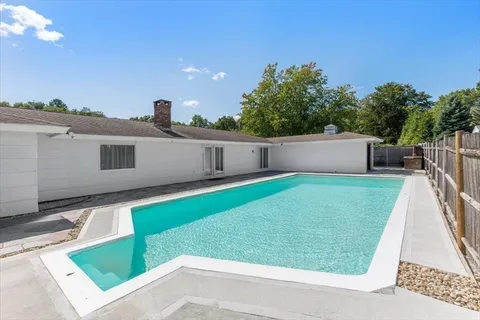 a view of a tree in front of a house