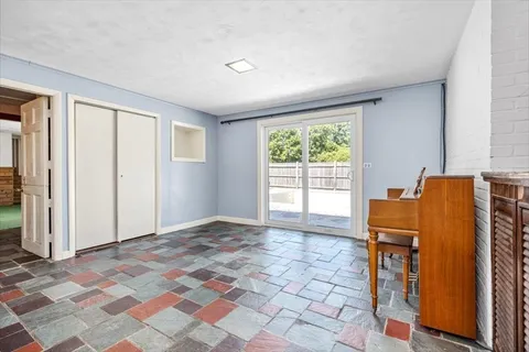 a view of a dining room with furniture window and outside view