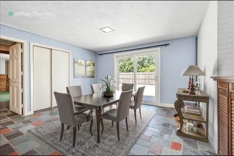 a kitchen with granite countertop appliances a sink and a window
