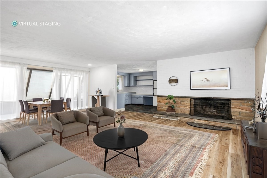 4 Richard Road Hingham, MA 02043 - Photo 10 of 37 a living room with furniture and a fireplace