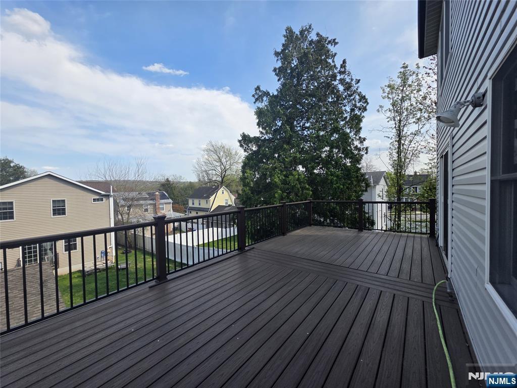 194 8th Street Cresskill, NJ 07626 - Photo 14 of 34 a view of deck with wooden floor and fence