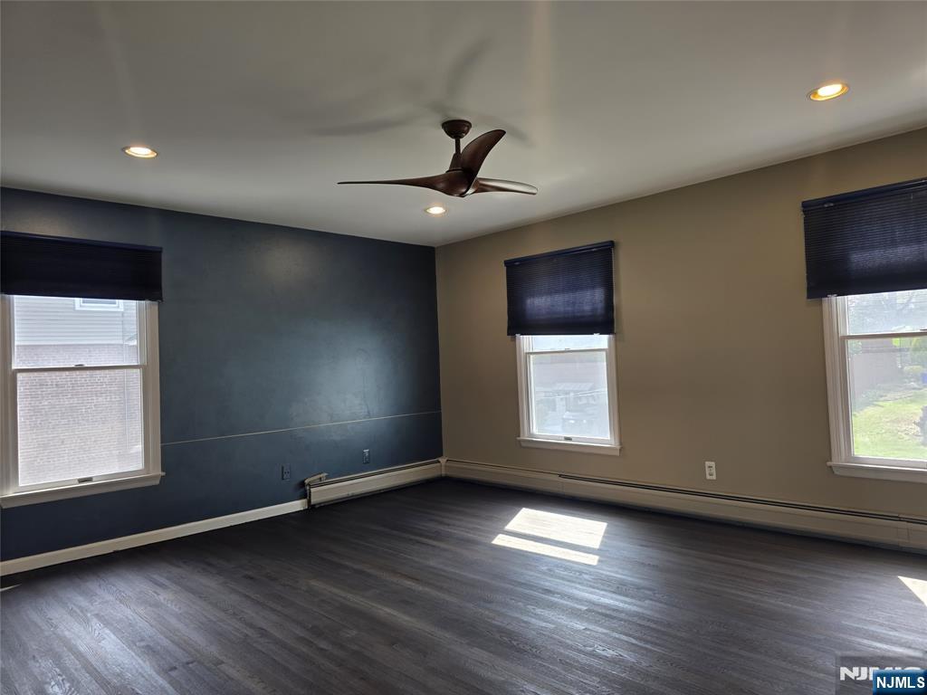 194 8th Street Cresskill, NJ 07626 - Photo 17 of 34 an empty room with wooden floor and windows