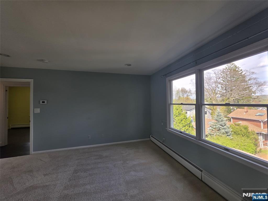 194 8th Street Cresskill, NJ 07626 - Photo 23 of 34 a view of an empty room with a window