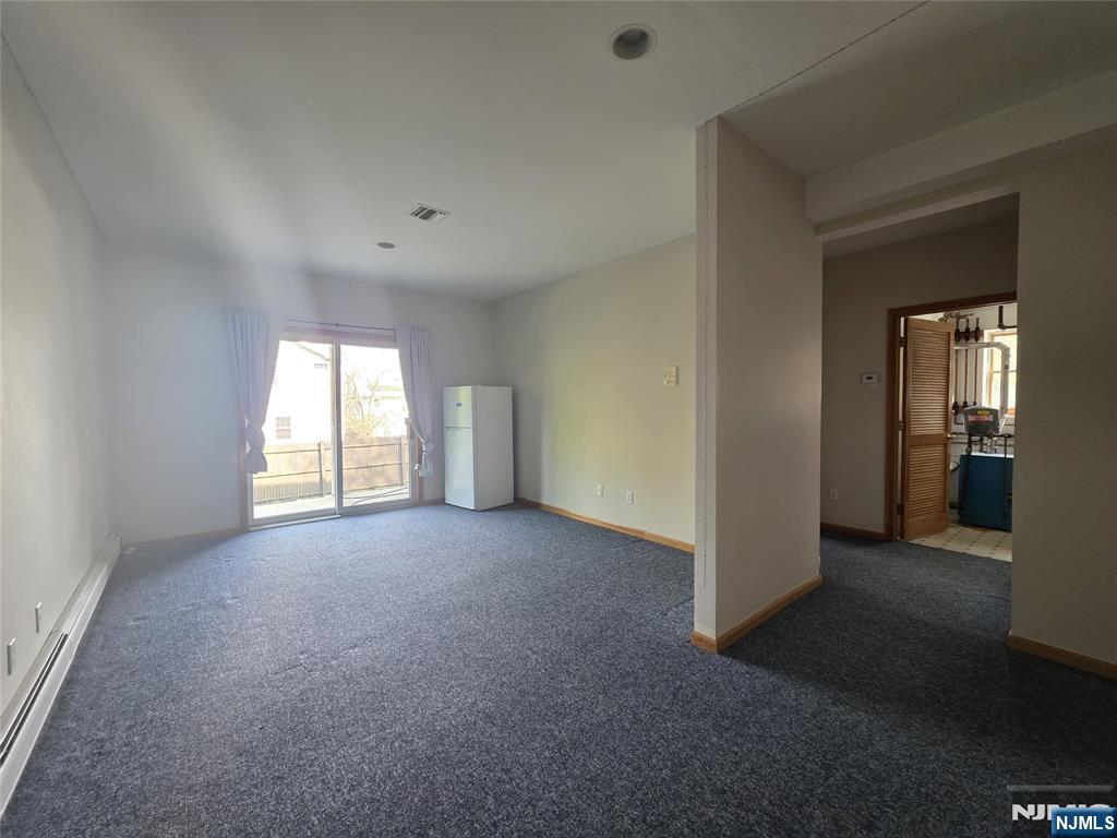 194 8th Street Cresskill, NJ 07626 - Photo 28 of 34 an empty room with windows and entrance