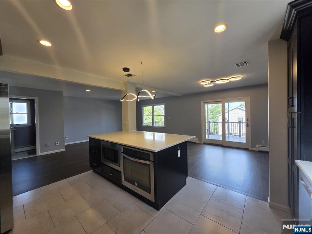 194 8th Street Cresskill, NJ 07626 - Photo 8 of 34 a kitchen with a stove and a window