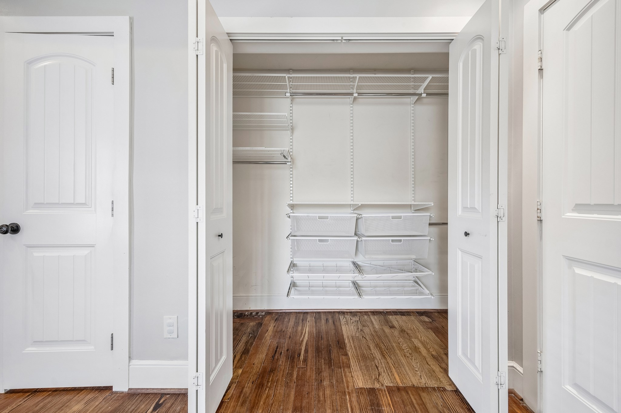 4412 Rusk Street Houston, TX 77023 - Photo 20 of 44 Spacious primary closet offers custom storage to enhance storage in the already large space!