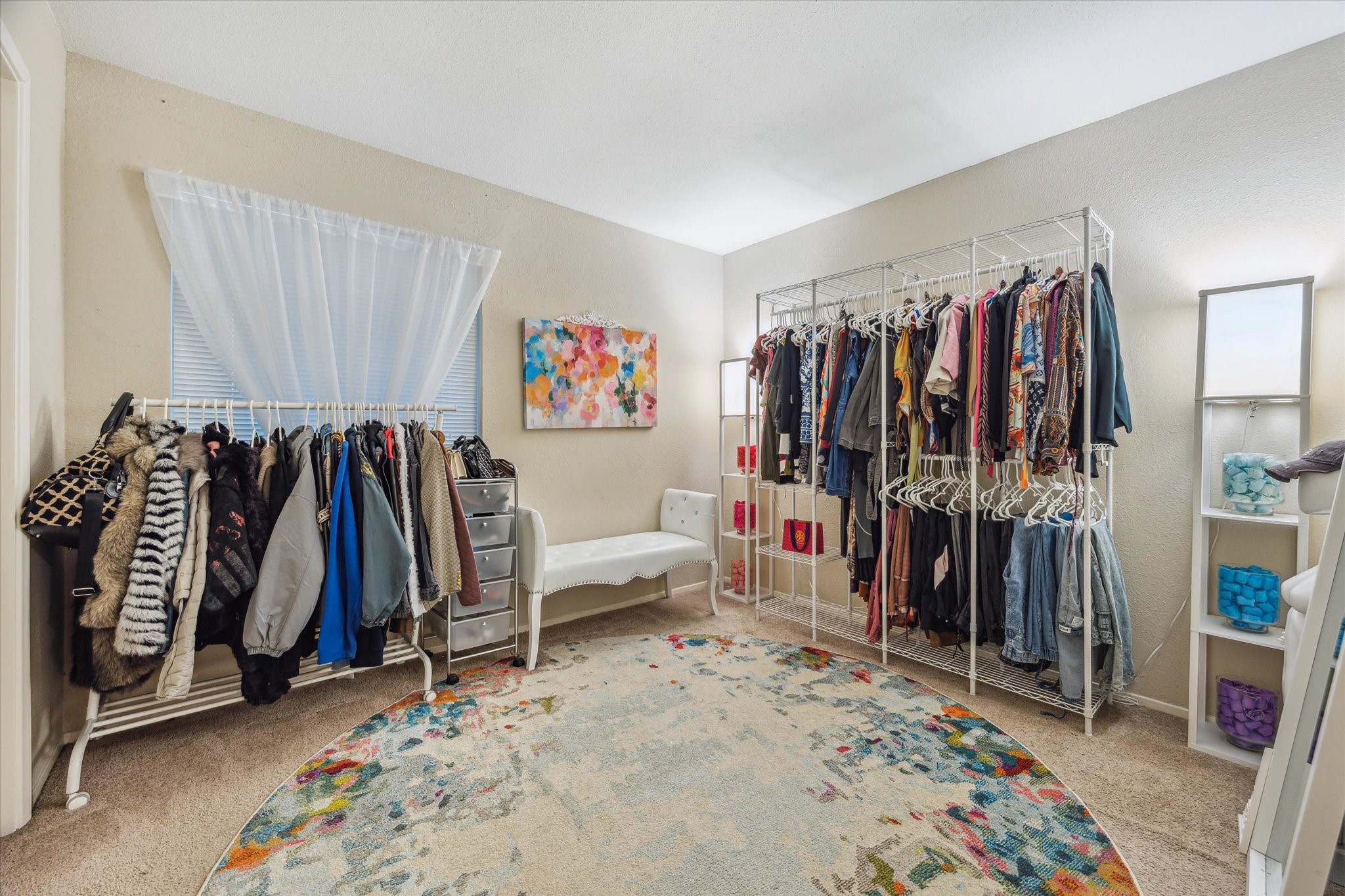 5667 Birchmont Drive, Unit A Houston, TX 77091 - Photo 14 of 18 a walk in closet with clothes and shoes