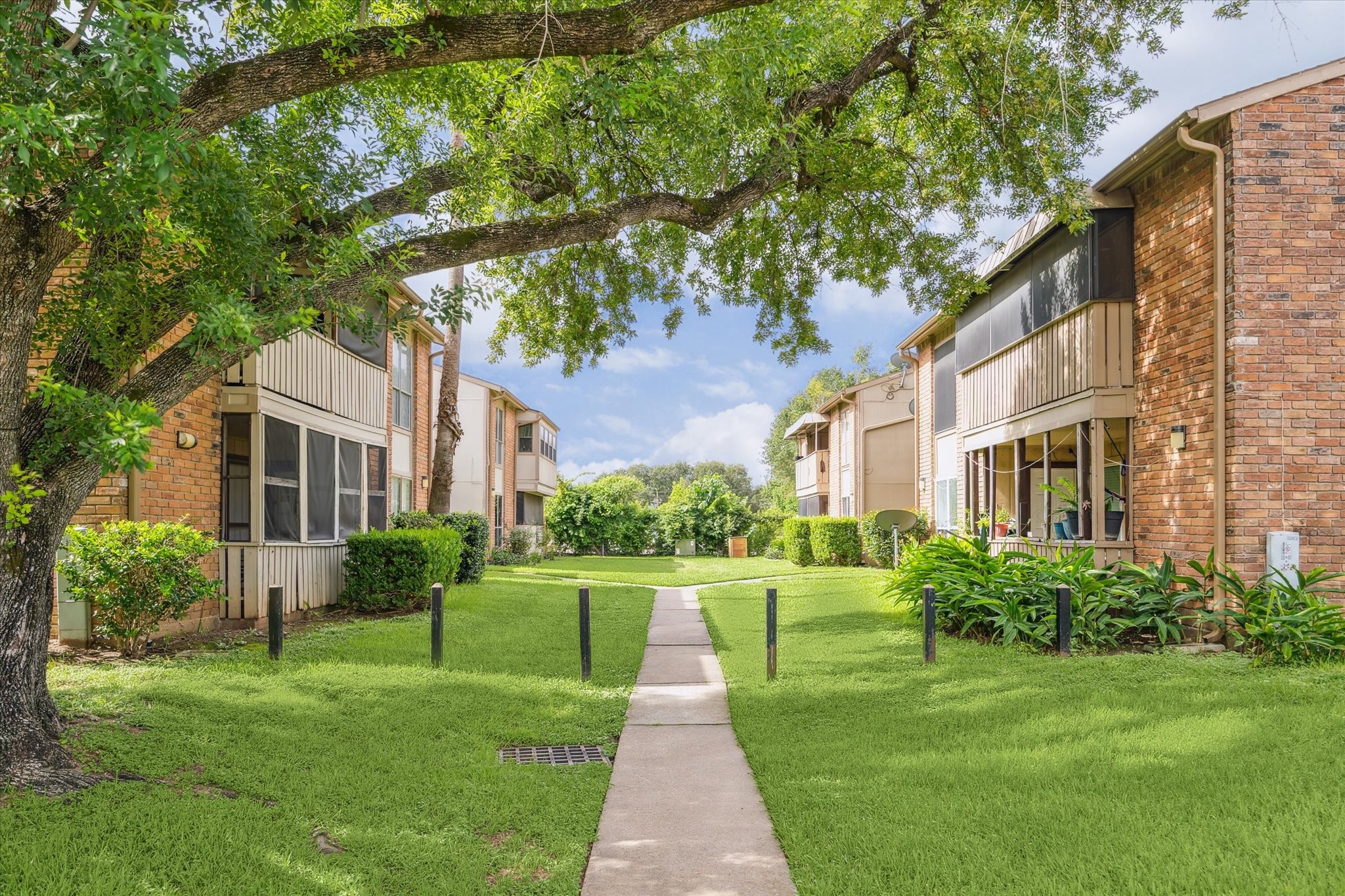 5667 Birchmont Drive, Unit A Houston, TX 77091 - Photo 2 of 18 a front view of a house with a yard