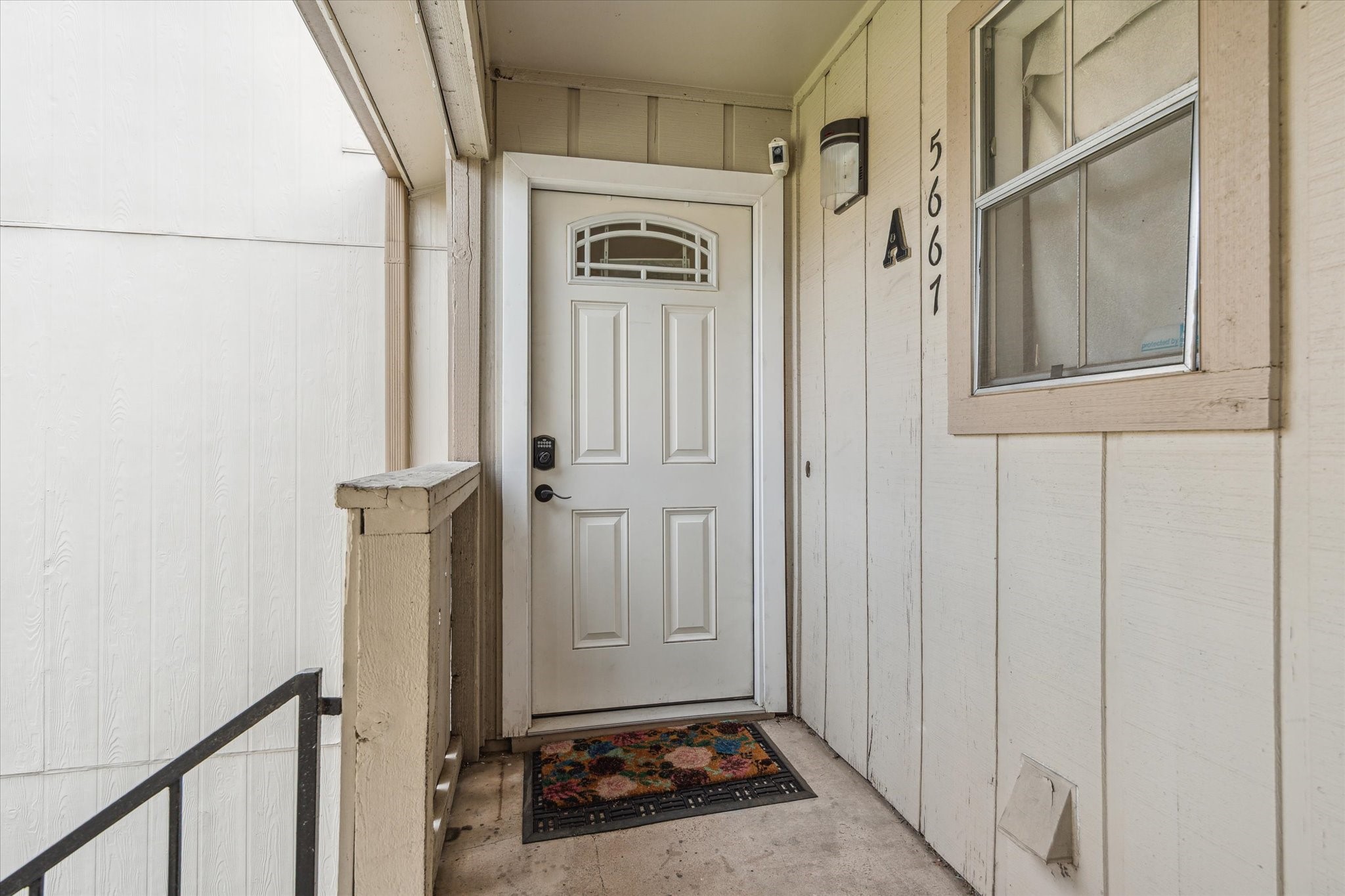 5667 Birchmont Drive, Unit A Houston, TX 77091 - Photo 3 of 18 a view of a door house with wooden door