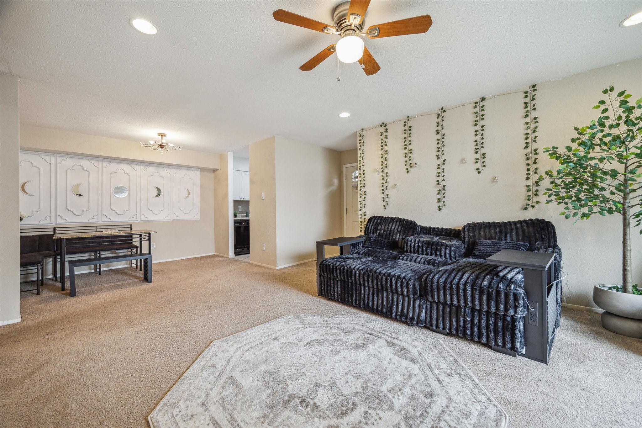 5667 Birchmont Drive, Unit A Houston, TX 77091 - Photo 7 of 18 a living room with furniture ceiling fan and a rug