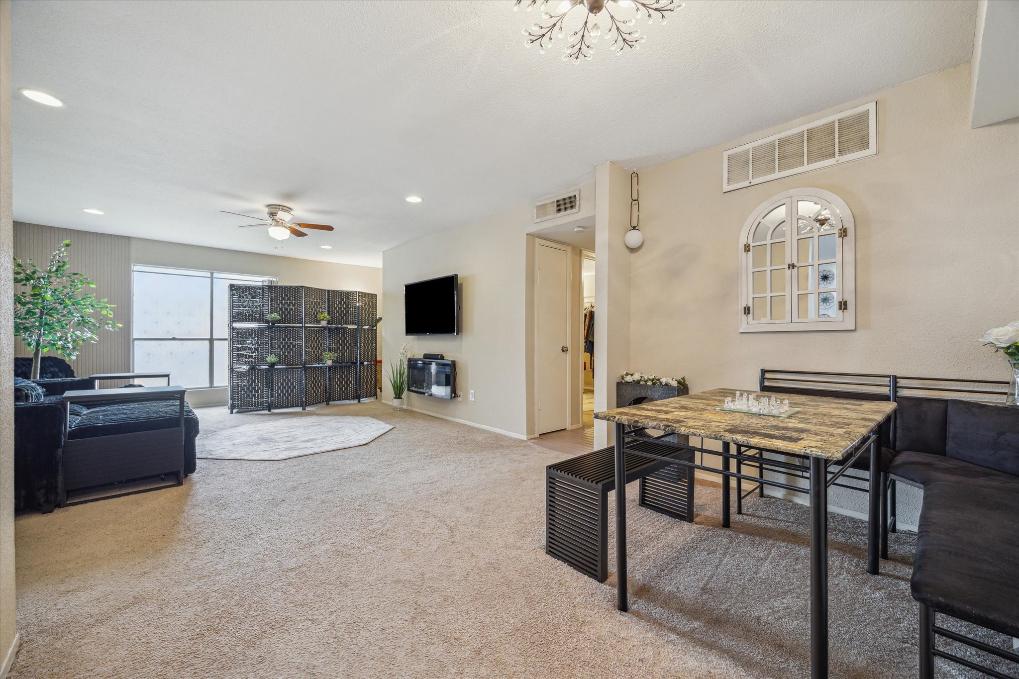 5667 Birchmont Drive, Unit A Houston, TX 77091 - Photo 8 of 18 a room with furniture and a flat screen tv