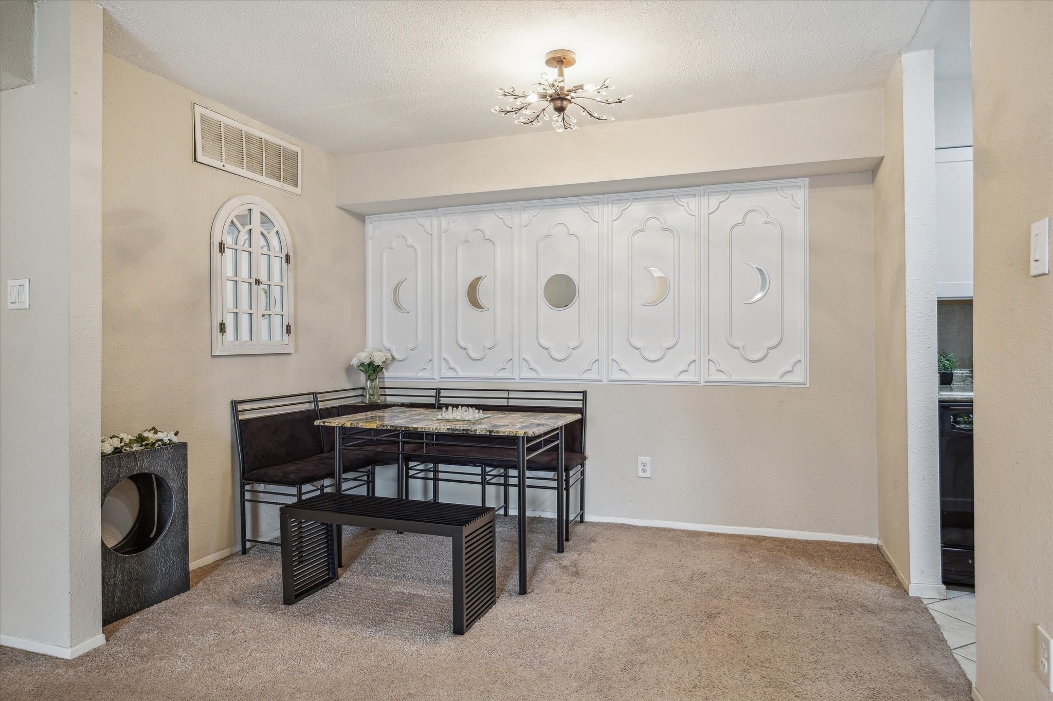5667 Birchmont Drive, Unit A Houston, TX 77091 - Photo 9 of 18 a room with furniture and a chandelier