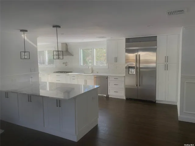 a view of a kitchen with a sink