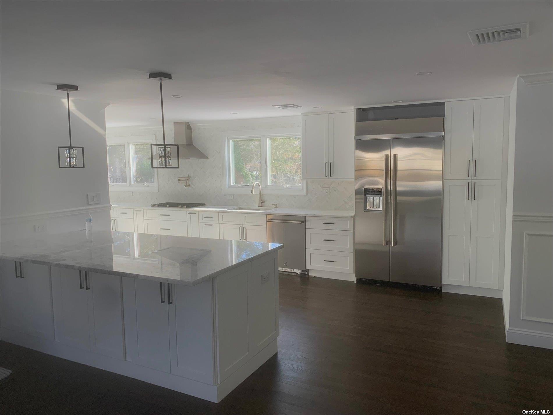 70 Nancy Boulevard Merrick, NY 11566 - Photo 3 of 7 a view of a kitchen with a sink