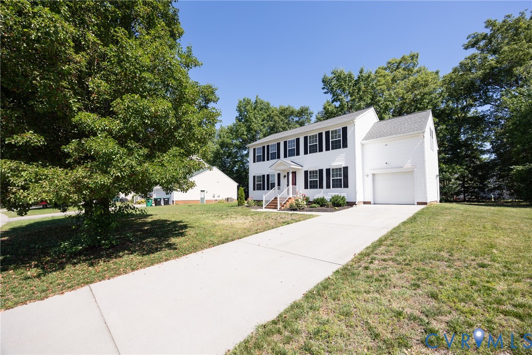 2928 Heather Ridge Drive Henrico, VA 23231 - Photo 33 of 34 White two-story residence featuring black window s
