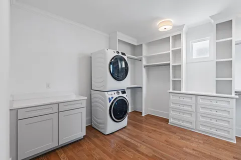 a view of walk in closet with empty racks