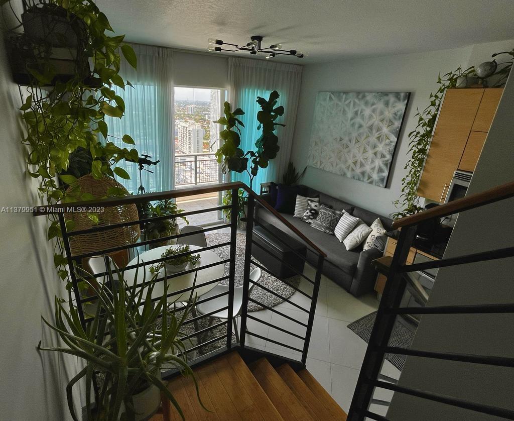 60 Southwest 13th Street, Unit 2413 Miami, FL 33130 - Photo 8 of 27 a view of an entryway with wooden floor