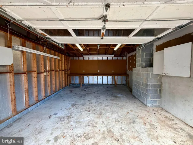 a view of a backyard with a tree