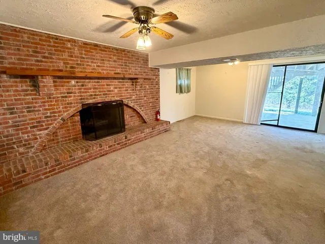 a view of an empty room with stairs