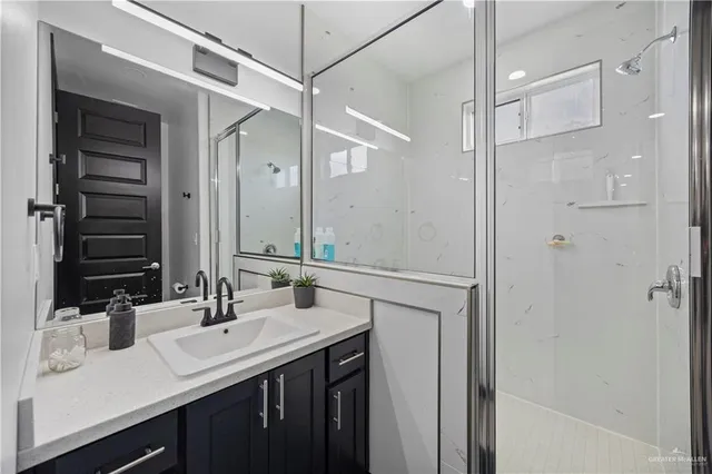 a bathroom with a double vanity sink mirror and double