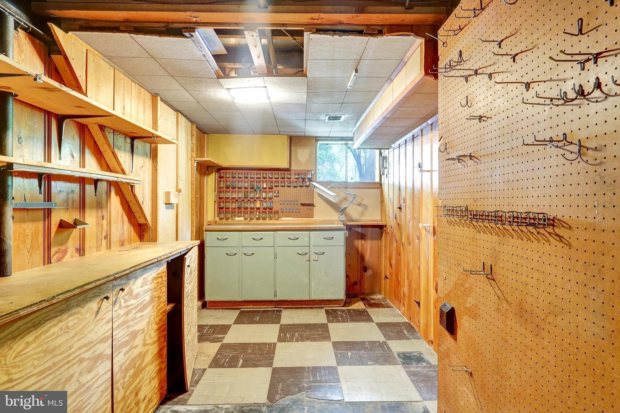10214 Big Rock Road Silver Spring, MD 20901 - Photo 33 of 39 Basement Tool Shelf/Work Area