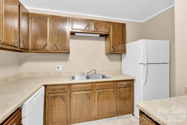 a kitchen with a stove and a sink