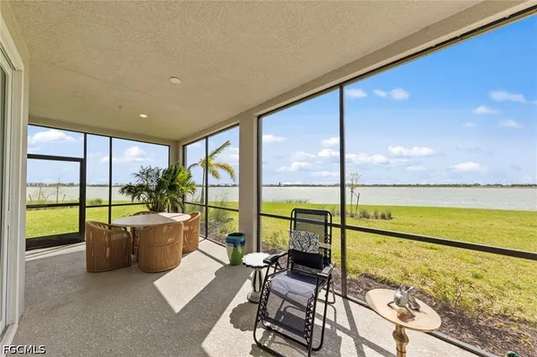 a view of a living room and floor to ceiling window