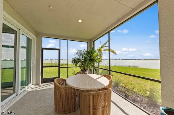 a view of an outdoor dining space with a table and chairs