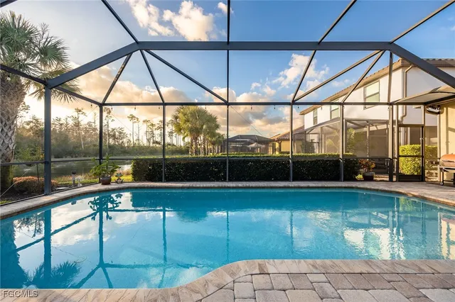 a view of a swimming pool with a patio